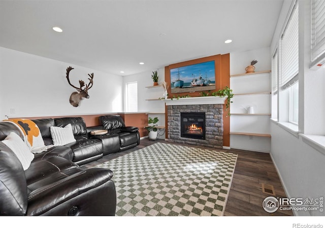 living area featuring recessed lighting, visible vents, and wood finished floors