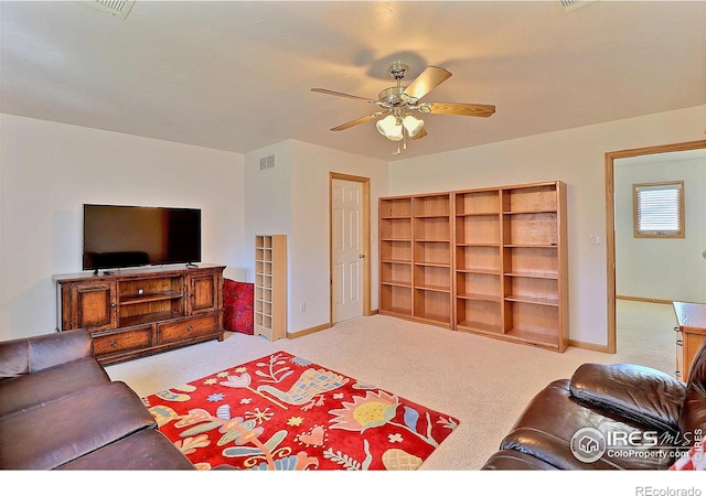 carpeted living room with ceiling fan, baseboards, and visible vents