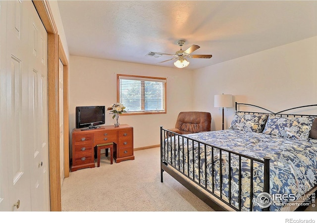 bedroom featuring ceiling fan, baseboards, visible vents, and carpet floors