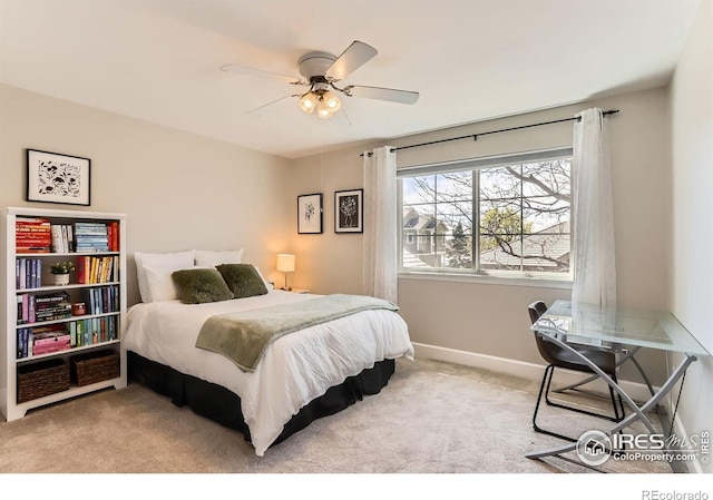 bedroom featuring ceiling fan, baseboards, and carpet floors