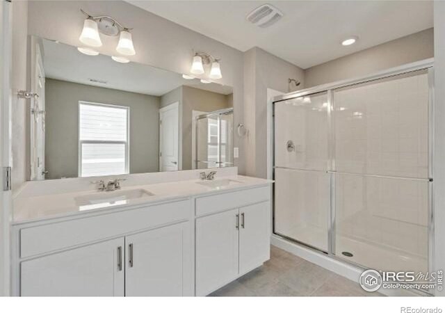 1898 Westport Ave, Berthoud, CO 80513 - bathroom with visible vents, a sink, and a stall shower