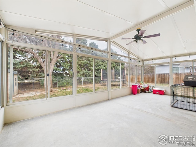 sunroom / solarium with a ceiling fan