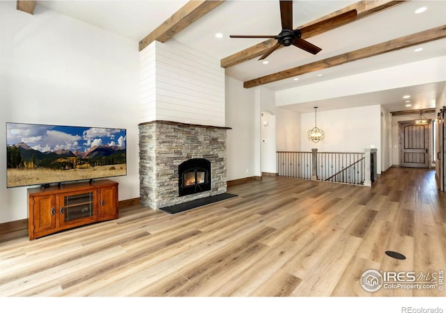 unfurnished living room with light wood finished floors, ceiling fan, beam ceiling, and recessed lighting