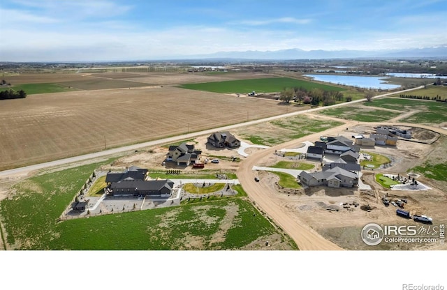 aerial view with a rural view and a water view
