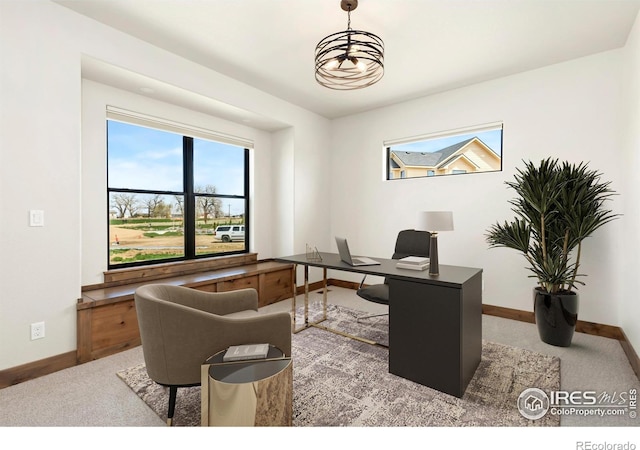 office area featuring baseboards and carpet flooring