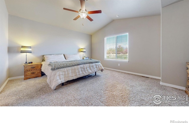carpeted bedroom featuring visible vents, vaulted ceiling, baseboards, and ceiling fan