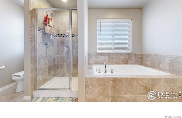 bathroom featuring tile patterned floors, a garden tub, a shower stall, and toilet