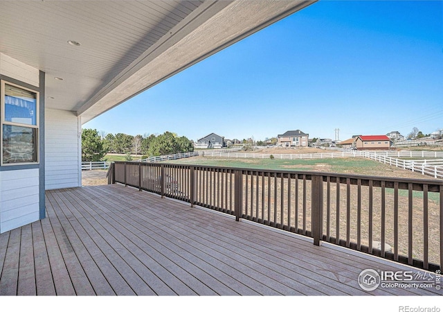 wooden terrace featuring a fenced backyard