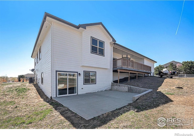 rear view of property featuring a patio