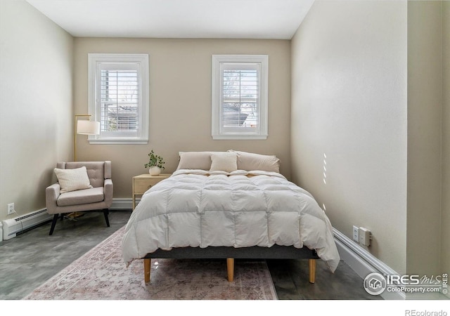 bedroom with a baseboard heating unit, baseboards, and multiple windows