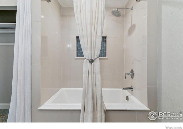 bathroom featuring shower / tub combo with curtain