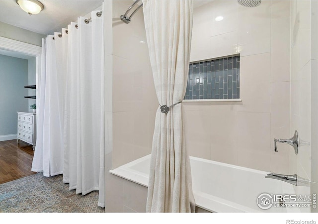 full bathroom with shower / bath combo