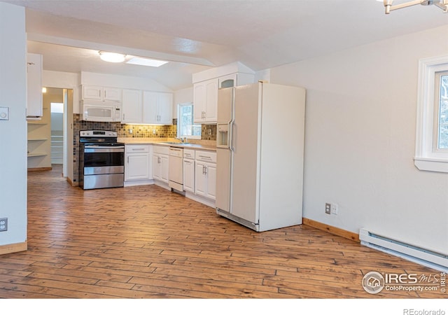 kitchen featuring light wood-style flooring, tasteful backsplash, white cabinetry, baseboard heating, and white appliances