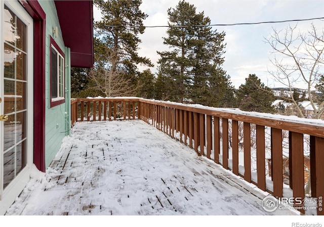 view of snow covered deck