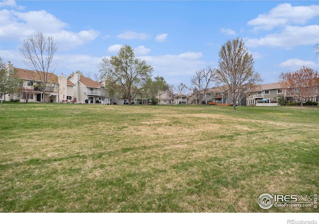 view of yard featuring a residential view