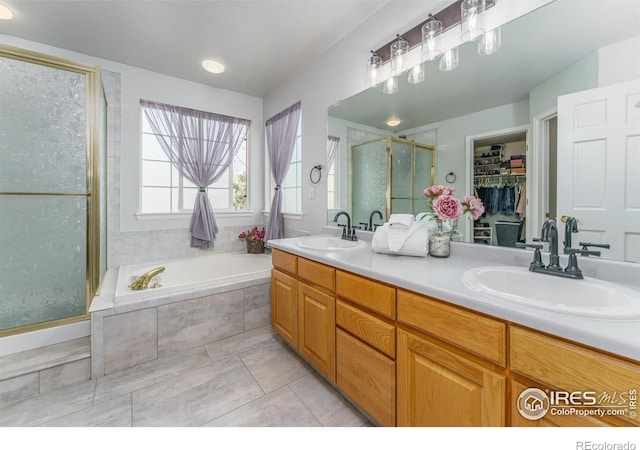 2225 Clayton Cir, Superior, CO 80027 - bathroom with a garden tub, a sink, double vanity, and a stall shower