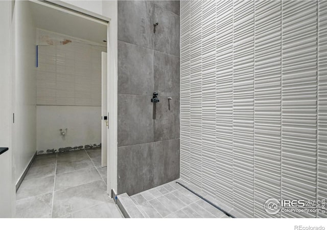 bathroom with tiled shower