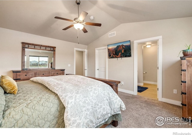 carpeted bedroom with vaulted ceiling, baseboards, visible vents, a ceiling fan, and connected bathroom