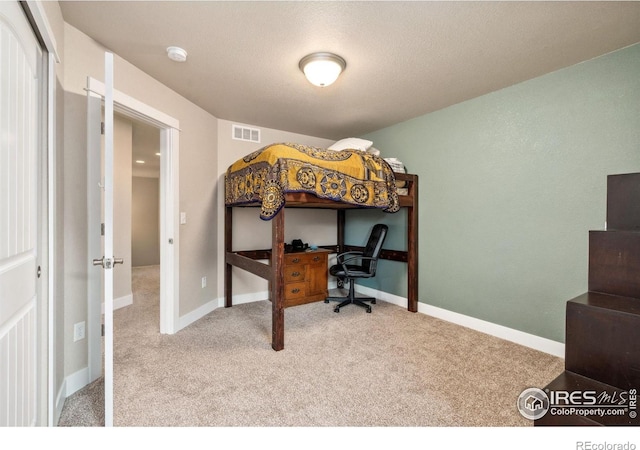 bedroom with baseboards, visible vents, and carpet floors