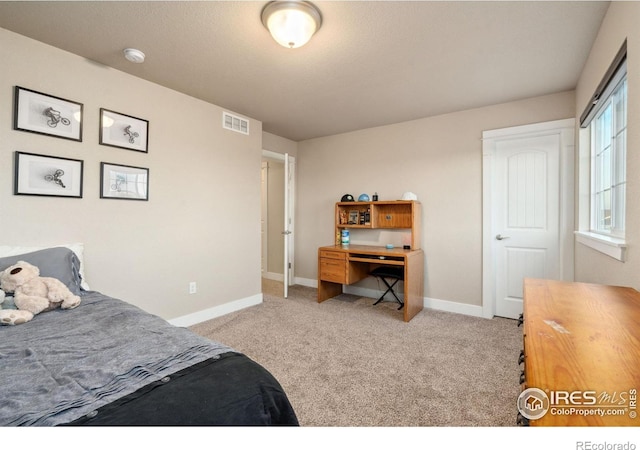 bedroom featuring baseboards, visible vents, and carpet