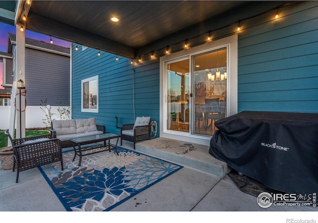 view of patio / terrace featuring grilling area, fence, and an outdoor living space