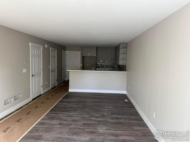 1687 Valency Dr, Loveland, CO 80537 - unfurnished living room featuring baseboards and dark wood-type flooring