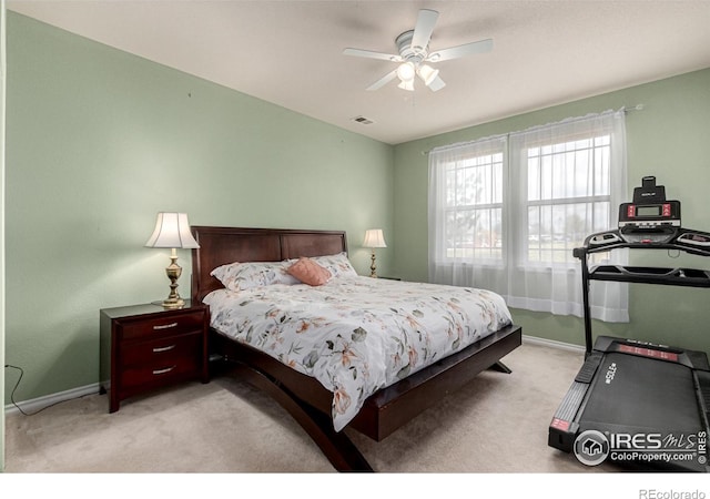 bedroom with carpet floors, a ceiling fan, visible vents, and baseboards