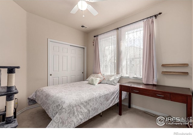 bedroom featuring a closet, visible vents, carpet flooring, and baseboards