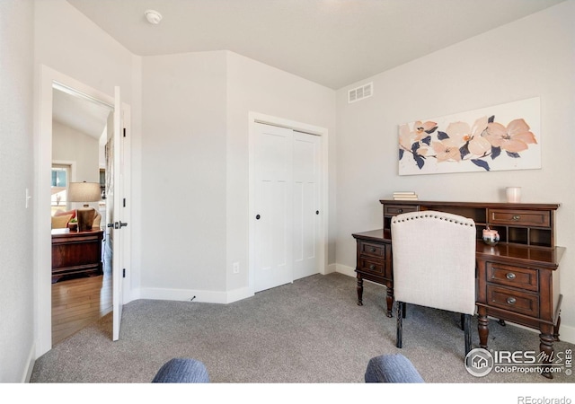 office with carpet floors, visible vents, and baseboards