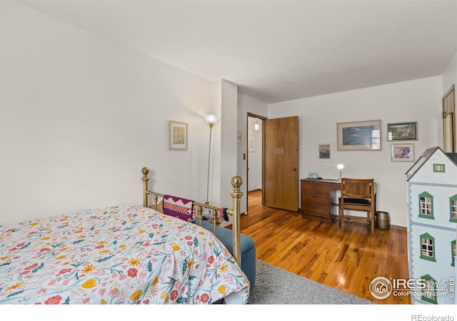 bedroom with wood finished floors