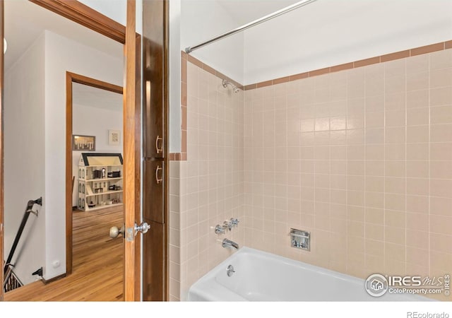 full bath featuring shower / bathtub combination and wood finished floors
