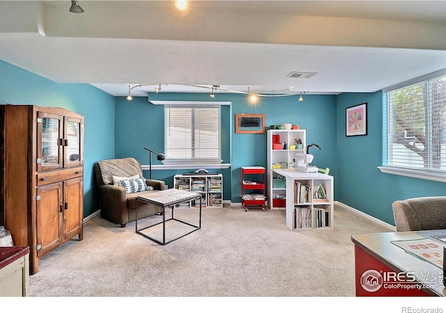 rec room with rail lighting, carpet, visible vents, and baseboards
