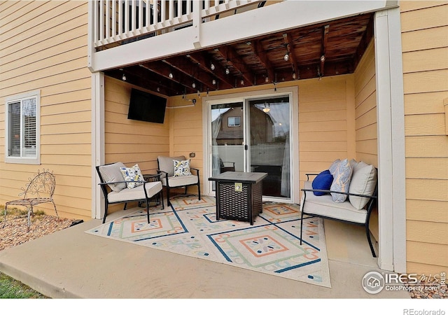 view of patio / terrace featuring a balcony and an outdoor living space