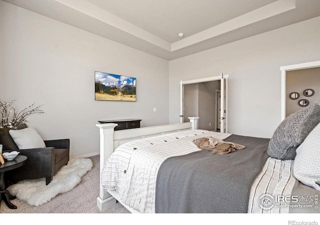 carpeted bedroom featuring baseboards