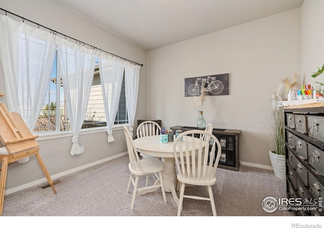dining space with visible vents, baseboards, and carpet floors