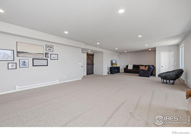 living area featuring a barn door, carpet flooring, baseboard heating, and recessed lighting