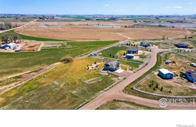 birds eye view of property featuring a rural view