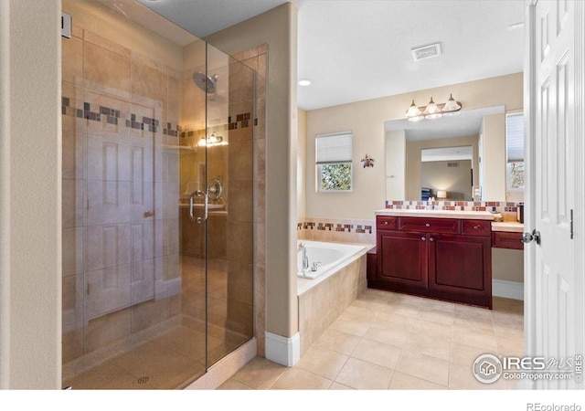 bathroom with a bath, a stall shower, visible vents, tile patterned flooring, and vanity