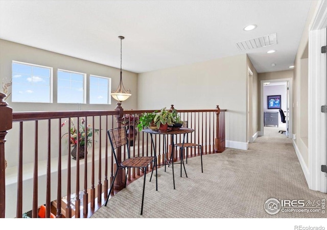 hall with baseboards, recessed lighting, visible vents, and carpet