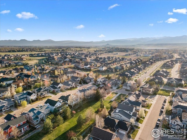 birds eye view of property with a residential view and a mountain view