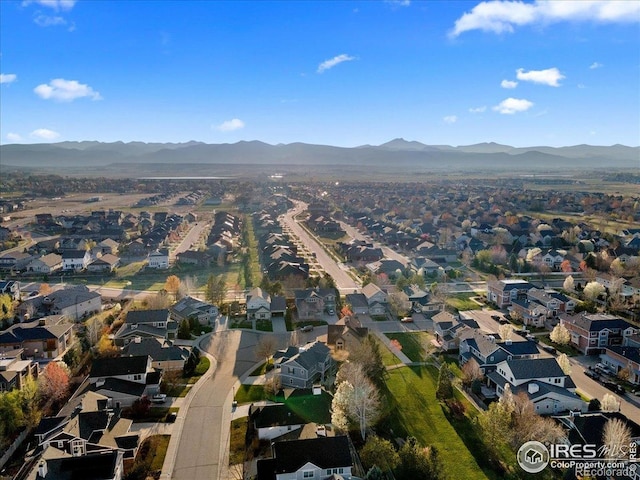birds eye view of property with a mountain view and a residential view