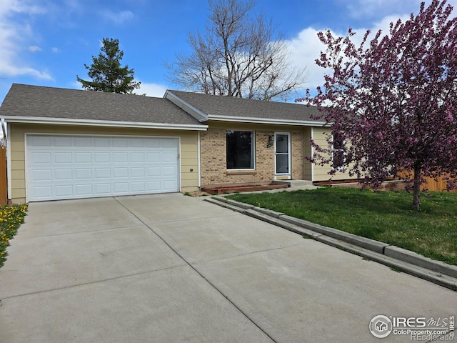 1504 Washington Ave, Louisville, CO 80027 - ranch-style house featuring roof with shingles, an attached garage, driveway, brick siding, and a front yard