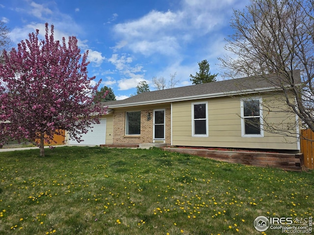 1504 Washington Ave, Louisville, CO 80027 - ranch-style home with brick siding, an attached garage, a front lawn, and roof with shingles