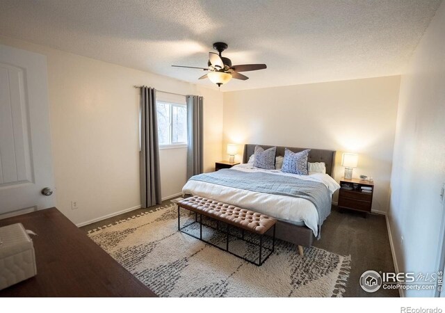 1504 Washington Ave, Louisville, CO 80027 - bedroom featuring a textured ceiling, carpet flooring, baseboards, and a ceiling fan