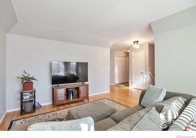 2131 Kay St, Longmont, CO 80501 - living room featuring baseboards and wood finished floors