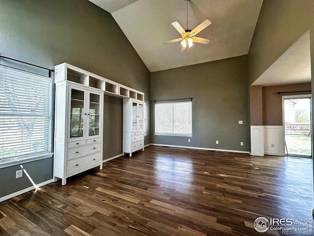 6502 Carmichael St, Fort Collins, CO 80528 - unfurnished bedroom featuring high vaulted ceiling, baseboards, a ceiling fan, and dark wood-style floors