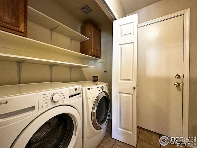 6502 Carmichael St, Fort Collins, CO 80528 - laundry room featuring cabinet space, light tile patterned flooring, visible vents, and independent washer and dryer