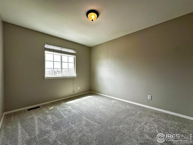 6502 Carmichael St, Fort Collins, CO 80528 - spare room featuring carpet floors, visible vents, and baseboards