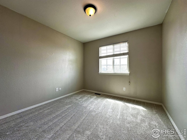 6502 Carmichael St, Fort Collins, CO 80528 - unfurnished room featuring visible vents, carpet flooring, and baseboards