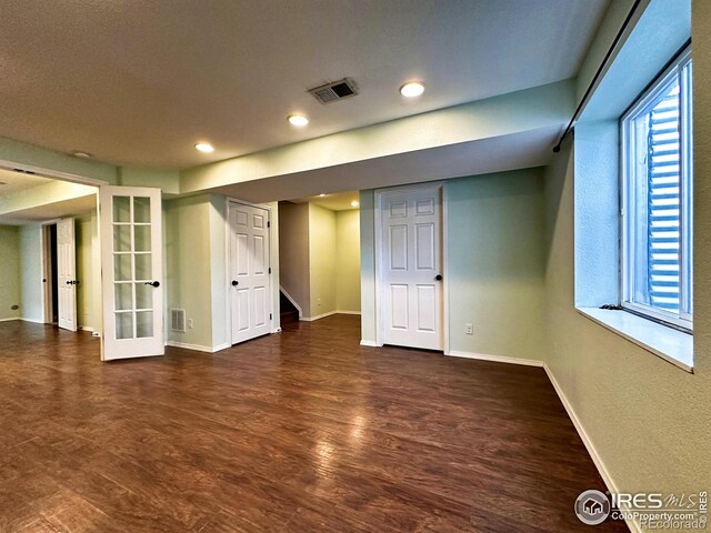 6502 Carmichael St, Fort Collins, CO 80528 - below grade area featuring baseboards, wood finished floors, visible vents, and recessed lighting